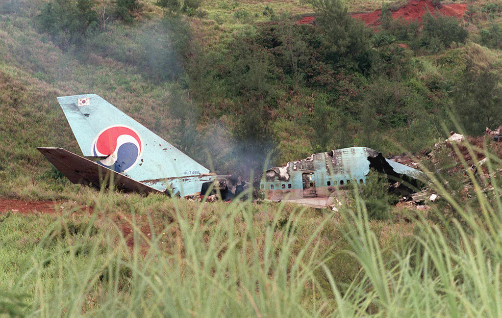 Smokes rises from wreckage of South Korean Air (KA
